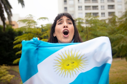 Young woman from Argentina celebrates world cup soccer tournament