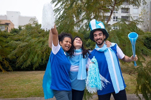 Group of friends  from Argentina celebrates world cup soccer tournament