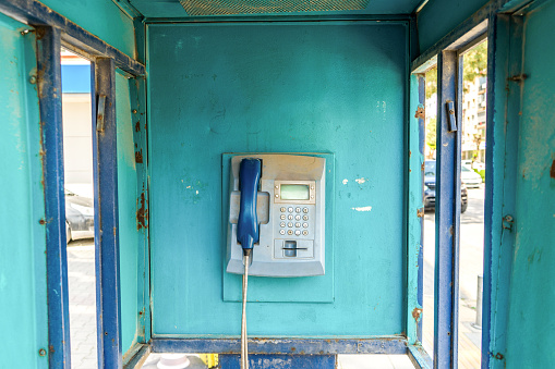 weathered blue color telephone booth