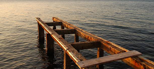 Old shabby pier stock photo