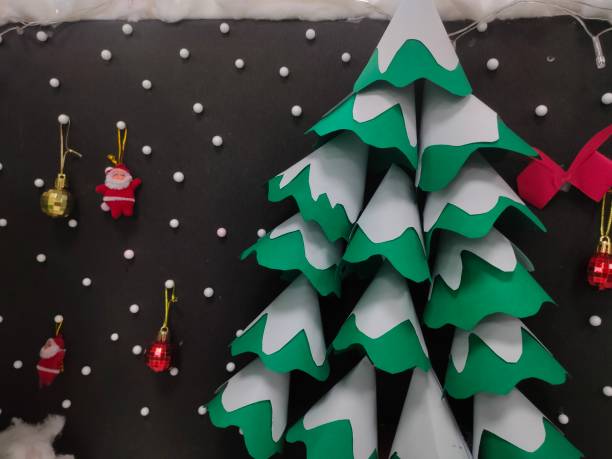 istock A beautiful background decorated with Christmas tree hanging Santa ornaments 1449653481