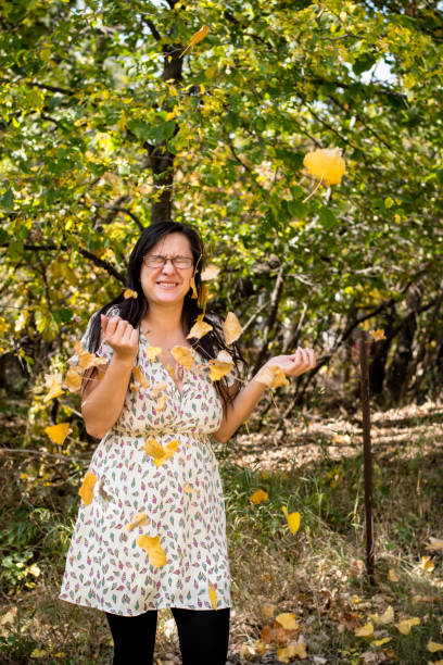 Portraits of an adult woman in a forest in winnipeg manitoba canada, during autumn