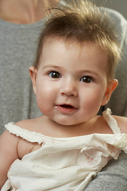 istock smiling blonde baby girl 144965647