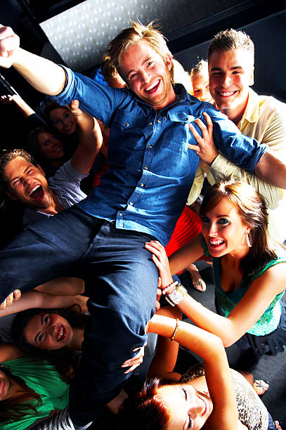 istock Group of young people dancing at a disco 144965655
