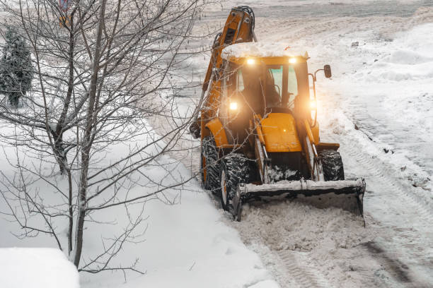 istock Tractor shoveling snow on the street. 1449657287