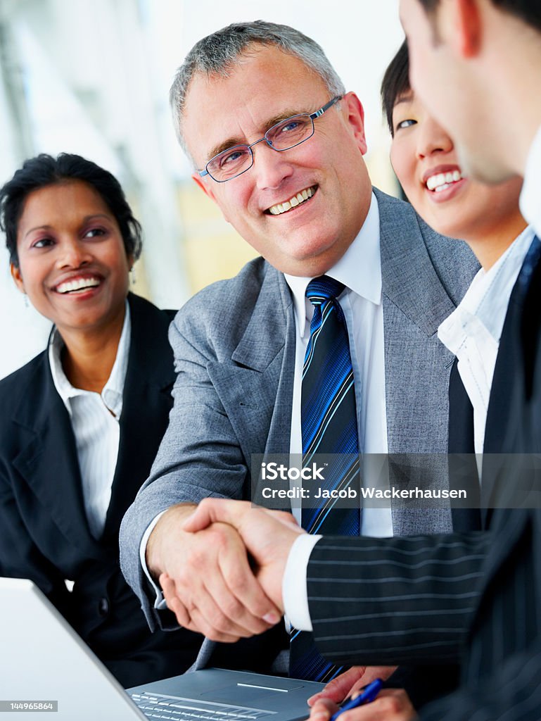 Businessmen shaking hands Handshake Stock Photo