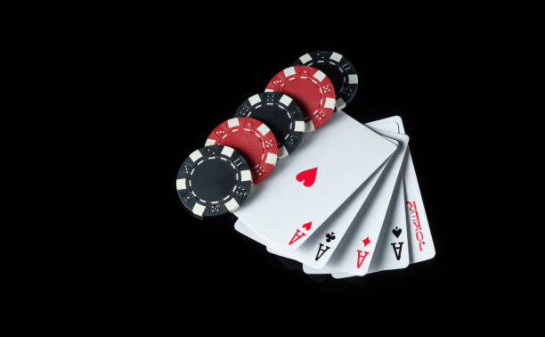istock Five of a kind or quads cards and chips in the black background. Maximum winning  combination at a poker club or casino 1449659295