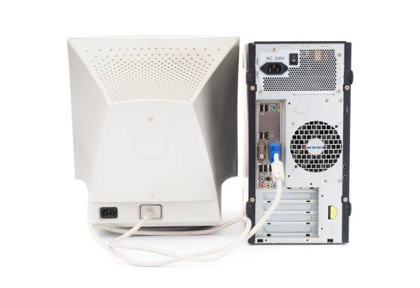 Old, vintage PC monitor with system unit on white background