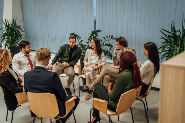 istock Business team sitting in circle and discussing 1449663138