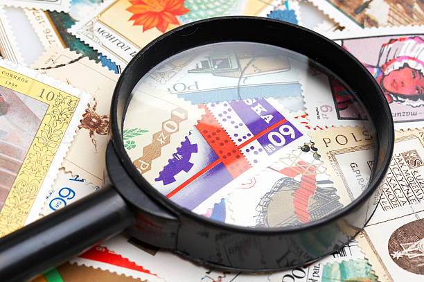 istock collection of stamps and magnifying glass 144966406
