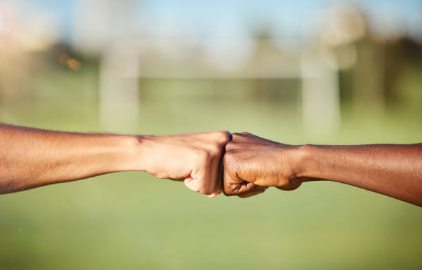 istock Fist bump, closeup and diversity meeting, team support and partnership outdoors. Hands of friends greeting with thank you, solidarity motivation or trust in a goal success and strategy achievement 1449664216