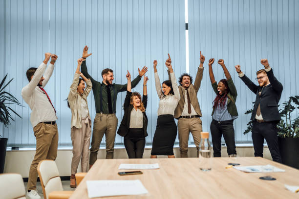 Office workers celebrating financial success