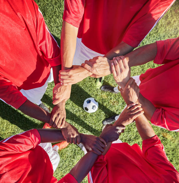 istock Soccer, hands and team sport with support before match, game or training with ball in circle group of men. Top of football field, pitch and grass with people showing trust, motivation and teamwork 1449667941