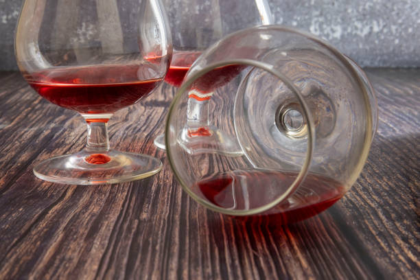 istock Lying glasses with red wine on the table. 1449669872