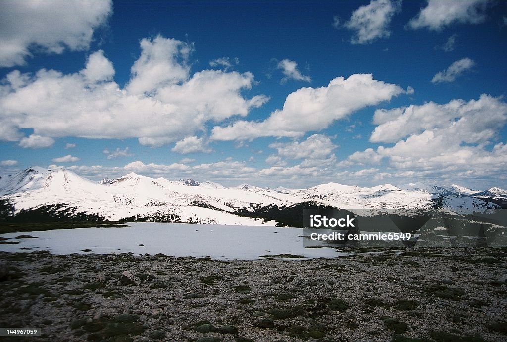 Colorado Rockies snowy mountains, lake view, clouds Backgrounds Stock Photo