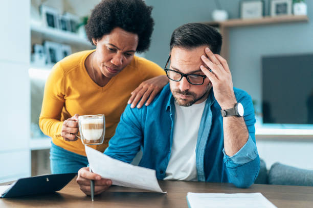 istock Couple doing their budget at home 1449673438