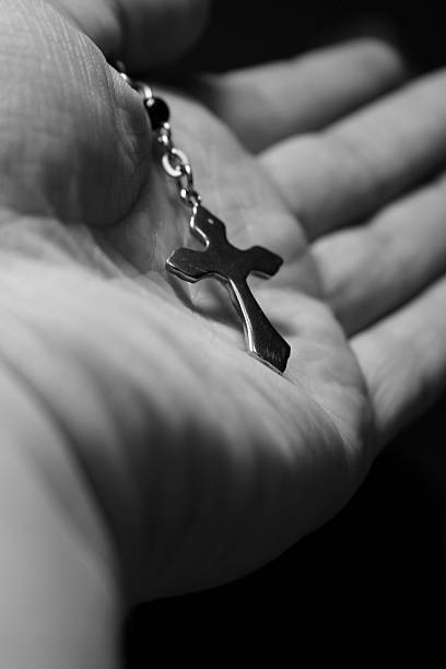 Hand holding a cross. stock photo