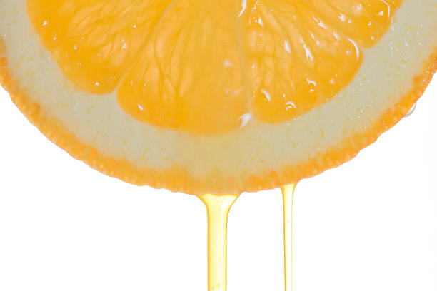 istock Orange slice with flowing juice 144969069