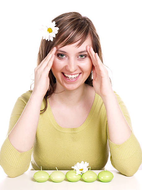 Young brunette woman relaxing/ on the white background stock photo