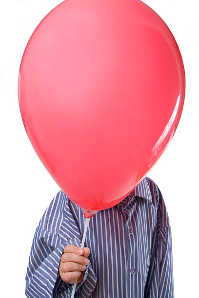 istock isolated boy holding balloon 144969572