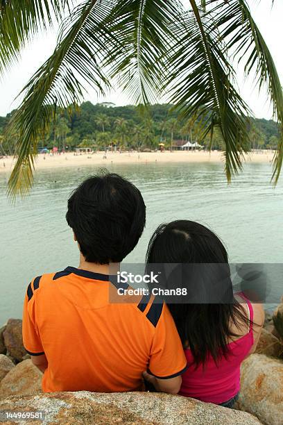 Lovers Under Palm Tree Stock Photo - Download Image Now - Adult, Beach, Beautiful People