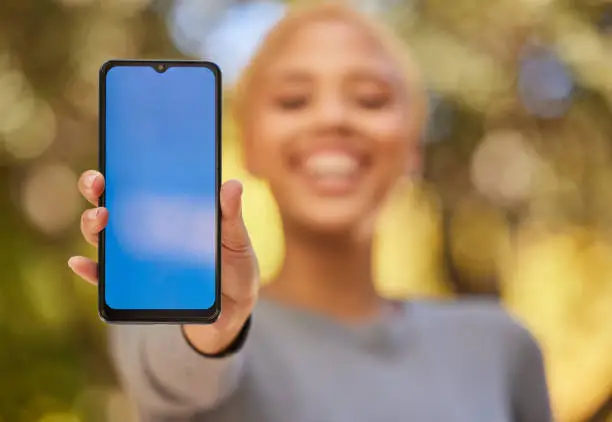 Photo of Green screen phone, mockup and woman blue mobile app for advertising, brand and digital marketing space. Hands, smartphone tech and social media, website network and multimedia web design connection