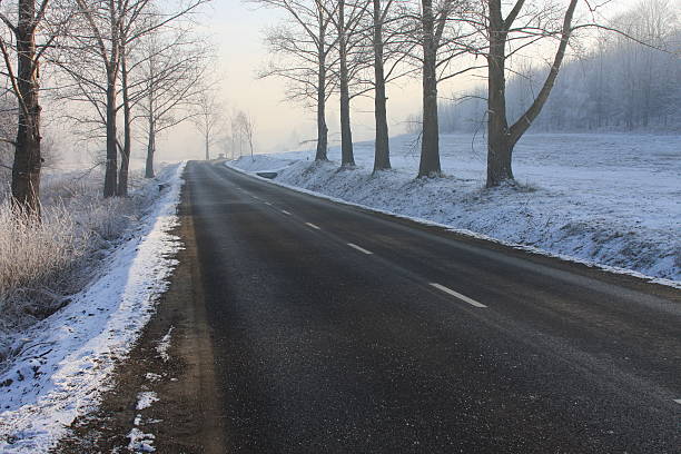 Slippery local road in Winter, stock photo