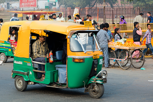 Delhi, India - January 22, 2020: Street scene in Delhi showing traffic including rickshaws, India, Asia.