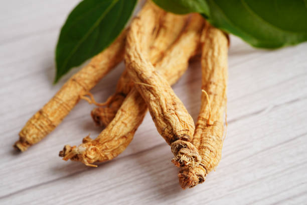 istock Ginseng roots and green leaf, healthy food. 1449702482