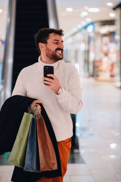 istock Man excited about Christmas shopping 1449703598