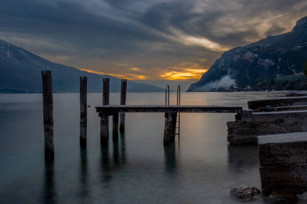 istock Deserted jetty on Lake Garda at sunset 1449704378