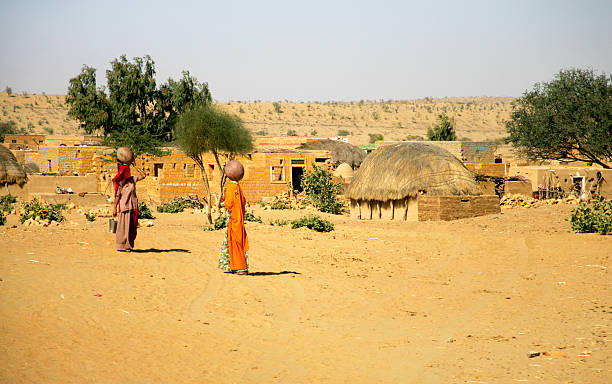 India Little village in Thar desert, Jaisalmer, Rajasthan, India thar desert stock pictures, royalty-free photos & images