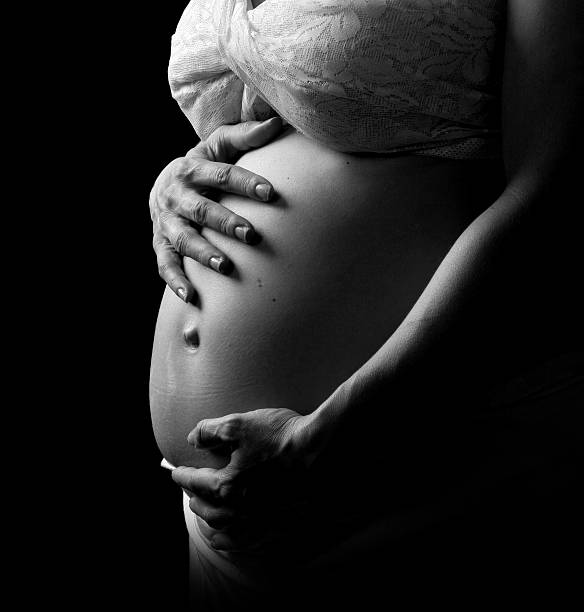 istock Pregnant woman holding her belly 144970732