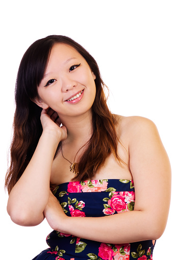 Smiling Chinese American Woman In Colorful Bare Shoulder Dress On White Background