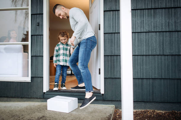 istock Father And Son Pick Up Package Delivery 1449712959