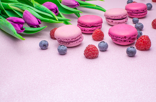 colourful macaroons with fresh flowers