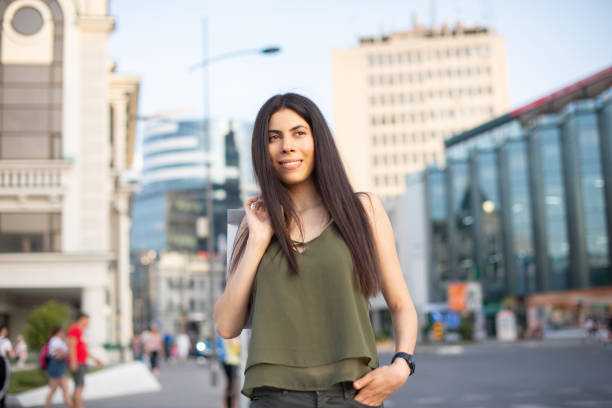 istock Young woman coming back from shopping 1449717611