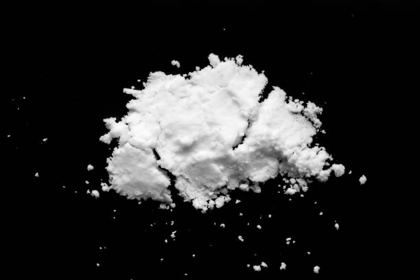 istock White snow isolated on black background close up 1449718166