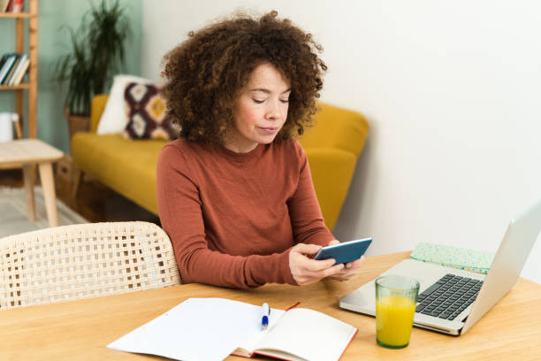 istock Young woman working from home 1449737397
