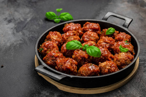 Traditional spicy meatballs in sweet and sour tomato sauce. Restaurant menu, dieting, cookbook recipe top view stock photo