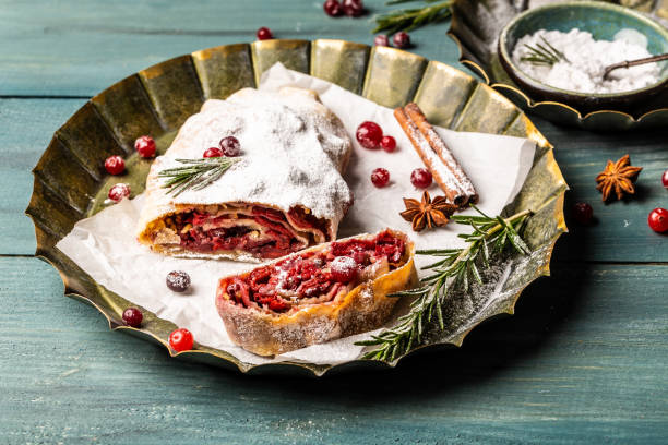 istock Strudel with a cherry. Cherry pie. winter dessert strudel with cherry, cranberries and walnut 1449737624
