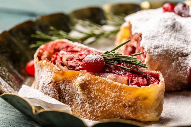istock Sliced cherry strudel with cranberries and walnut. Food recipe background 1449737637