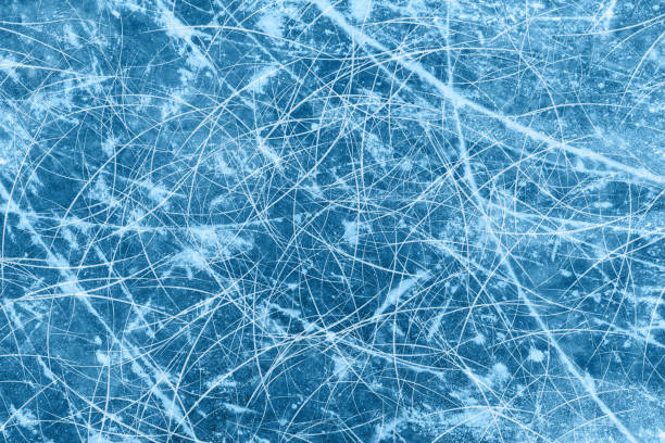 istock Ice blue background with ice skating tracks. 1449737970