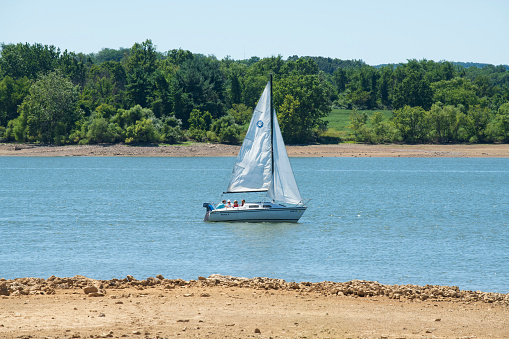 Clinton, USA - August 13, 2022. People sailing on lake at Spruce Run Recreation Area in Clinton, New Jersey, USA