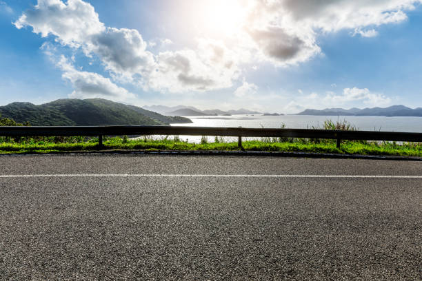 istock Asphalt road and sea at sunrise 1449753912