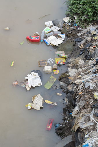 Packaging, bottles, plastic bags etc thrown in the river