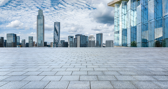 Empty square floors and modern city skyline with buildings in Ningbo, Zhejiang, China.