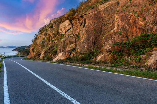 istock Asphalt road and mountain at sunset 1449755681