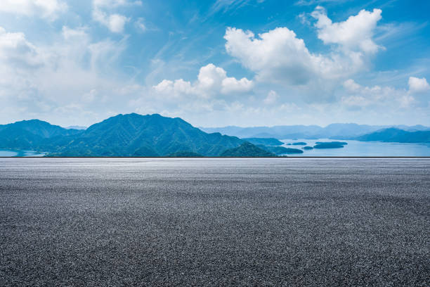istock Asphalt road and mountain background 1449755705