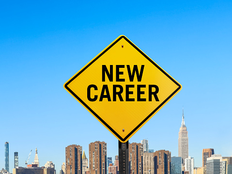 Road sign with “New career “ text in front of New York City